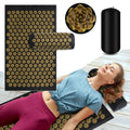 Woman relaxing on GlowVibe Relief acupressure mat and pillow